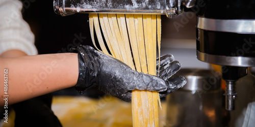 cooking homemade noodles on a noodle machine close-up