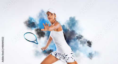 Tennis player. Beautiful girl teenager and athlete with racket in sporswear and hat isolated on white background. Sport concept. © Mike Orlov