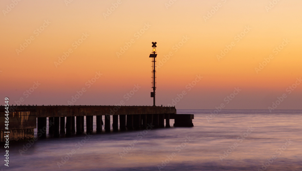 pier after the sunset with sky and sea