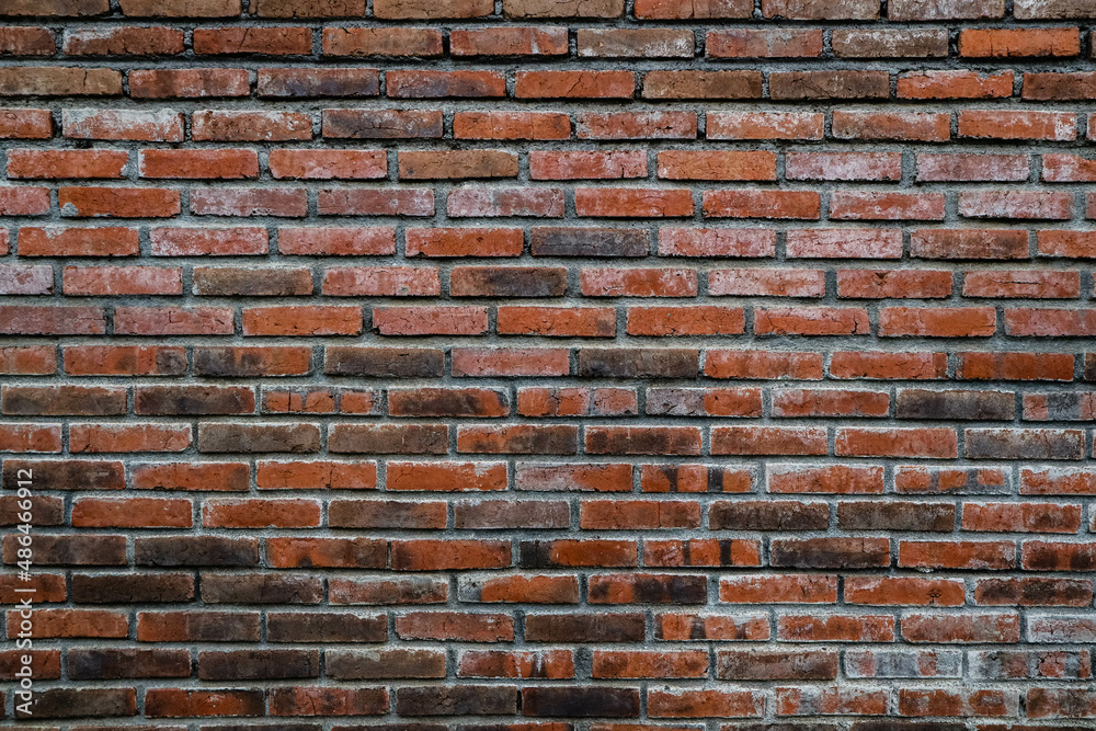 Obraz premium Old grunge dirty brick wall surface. Abstract tiled brick work background and pattern.