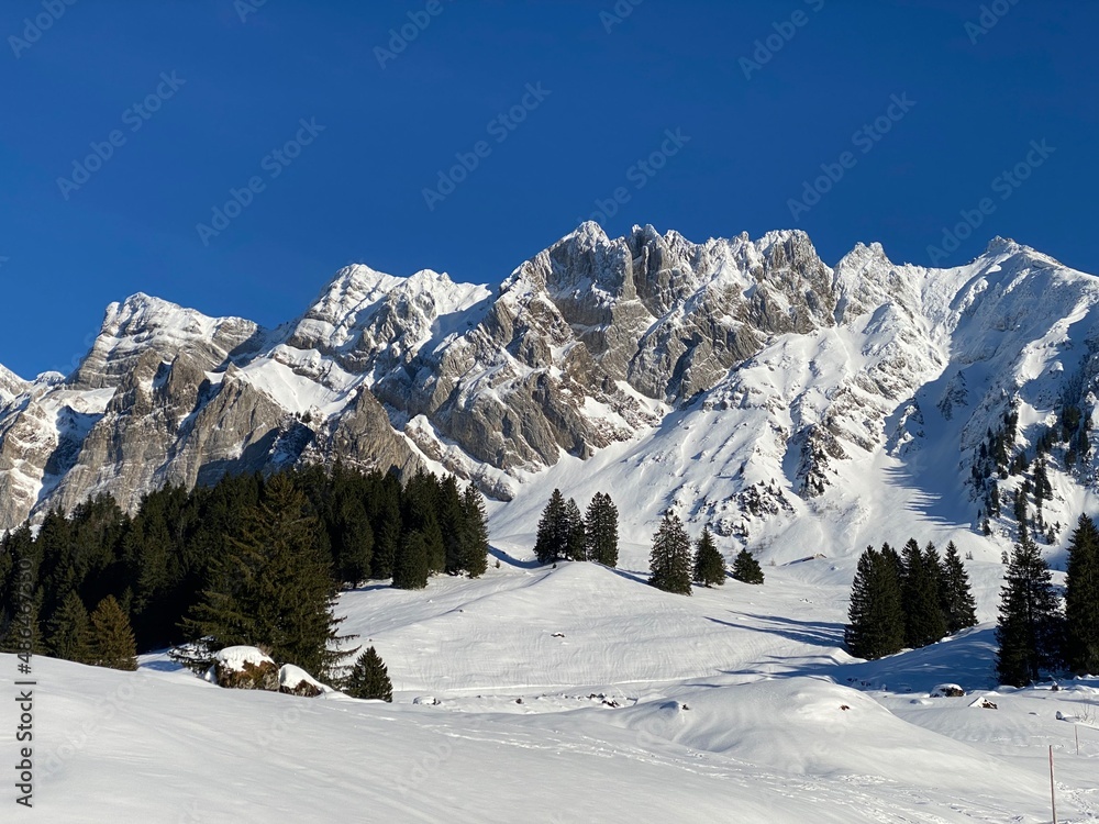 Winter ambience and beautiful idyllic atmosphere on the snow-capped Alpine mountain Alpstein in the Appenzell Alps massif - Switzerland (Schweiz) Winter ambience and beautiful idyllic atmosphere on the snow-capped Alpine mountain Alpstein in the Appenzell Alps massif - Switzerland (Schweiz)
