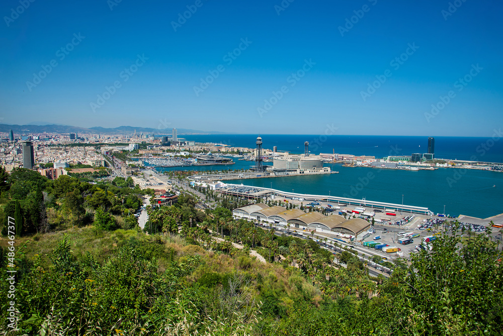 Panoramic view over Passeig de Colom, La Barceloneta, Port Vell marina, Christopher Columbus monument in Barcelona city, Catalonia, Spain