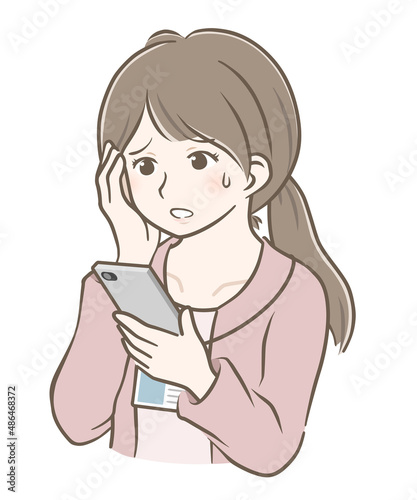 スマホを見て焦る若い私服女性社員