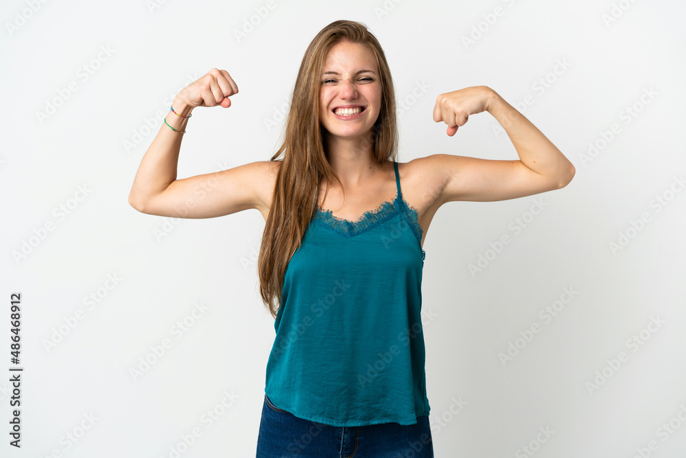 Young caucasian woman over isolated background doing strong gesture Young caucasian woman over isolated background doing strong gesture