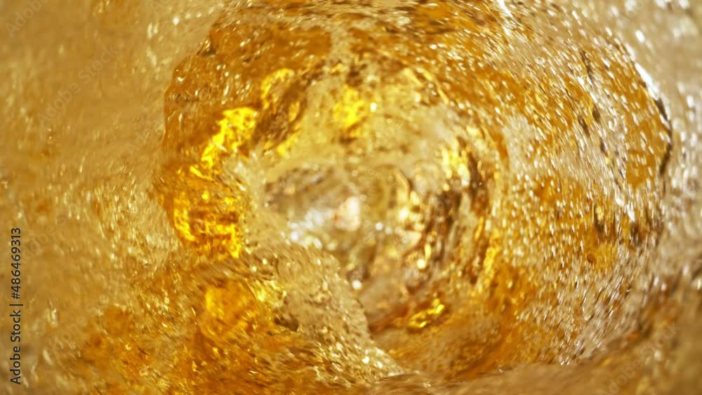 Super slow motion of pouring beer in twister shape. Filmed on high speed cinema camera 1000 fps. Ultimate inside bottle view filmed with special wide angle macro lens.