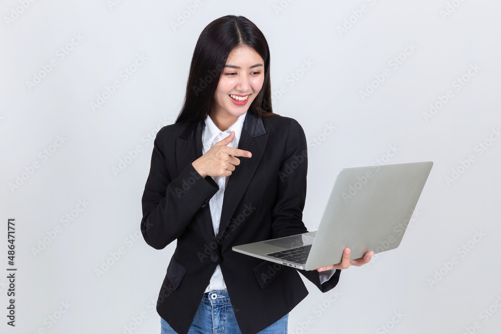attractive business woman wearing office clothing successful hold computer laptop , Technology communication lifestyles concept. attractive business woman wearing office clothing successful hold computer laptop , Technology communication lifestyles concept.