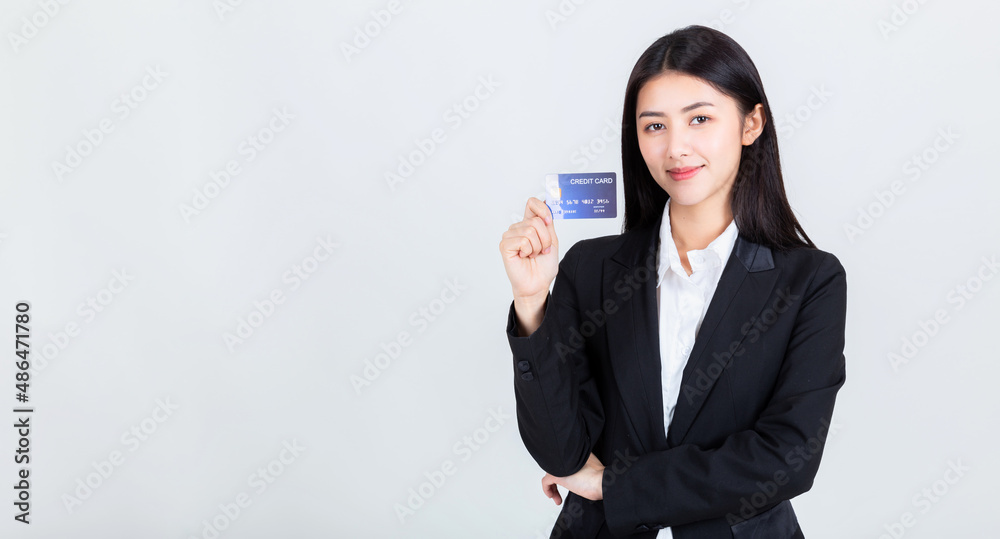 asian business woman wearing office clothing hands show credit card ,credits card and payment concept. asian business woman wearing office clothing hands show credit card ,credits card and payment concept.