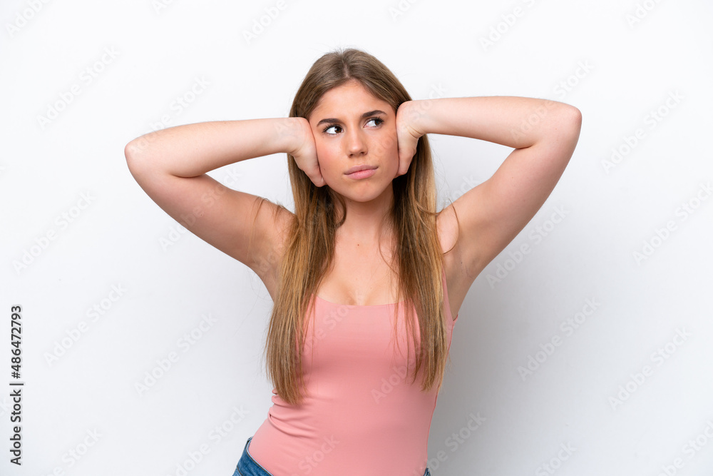 Young caucasian woman isolated on white bakcground frustrated and covering ears Young caucasian woman isolated on white bakcground frustrated and covering ears