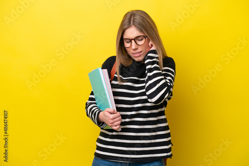 Young student woman isolated on yellow background background frustrated and covering ears