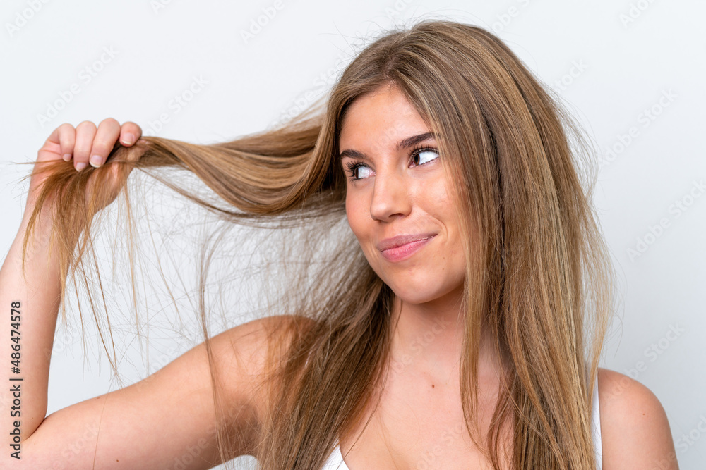 Fototapeta premium Young caucasian woman isolated on white background with tangled hair. Close up portrait