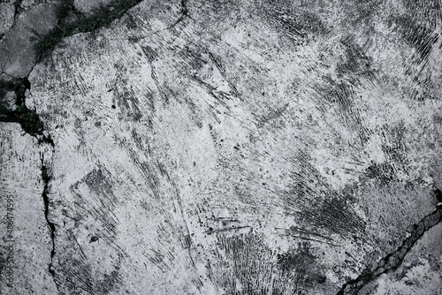 Old grunge dirty textured cement wall surface. With uneven stains and tiny holes.
