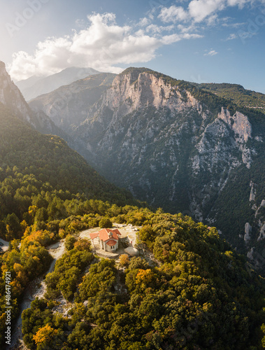 Aerial drone panoramic view of a little chapel of the Prophet Elias in deep canyon near legendary Mountain Olympus - the pantheon of all Greek gods and Great Zeus.