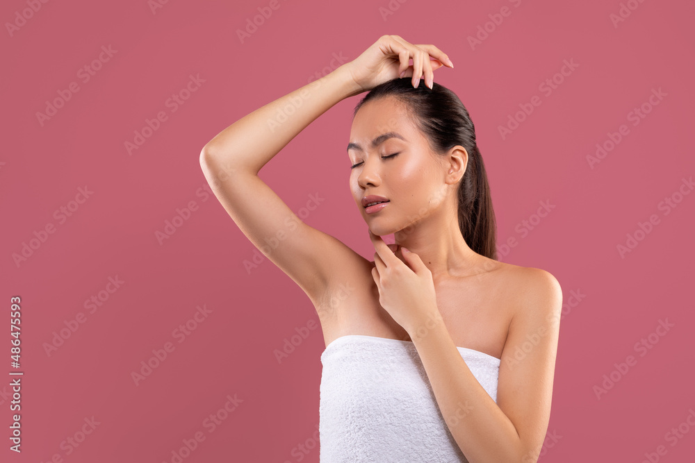 Sensual japanese woman showing her clean and hairless armpit Stock