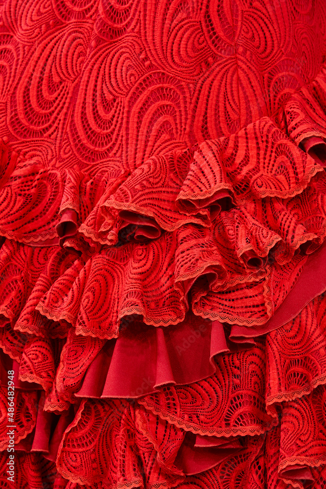 Flamenco dress outfit detail, red color. Elegant spanish woman clothing