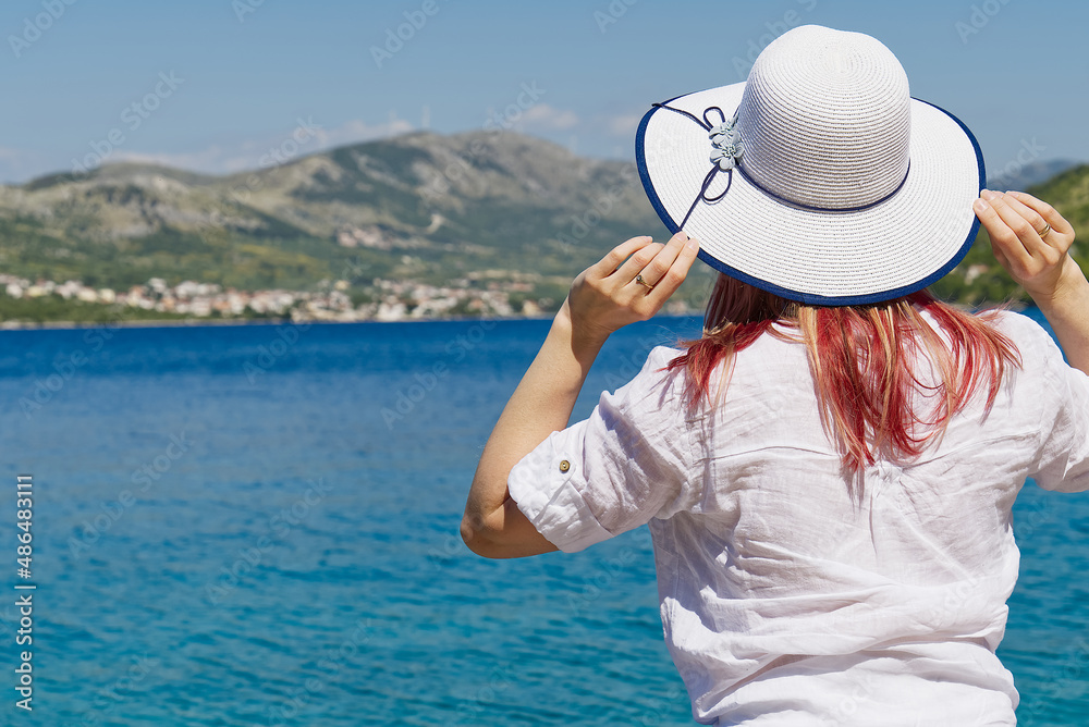 happy beautiful young woman enjoying freedom and the sea view, summer vacation concept