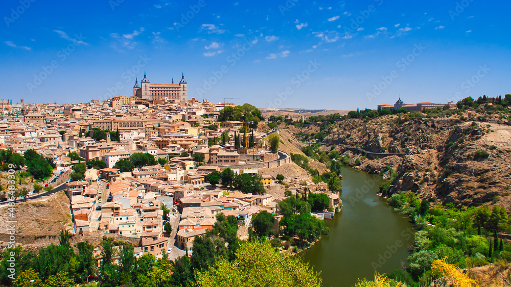 An overview of the city of Toledo and Tagus River - obrazy, fototapety, plakaty 