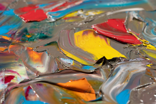 Mixed oil paints close-up. Colorful abstract background