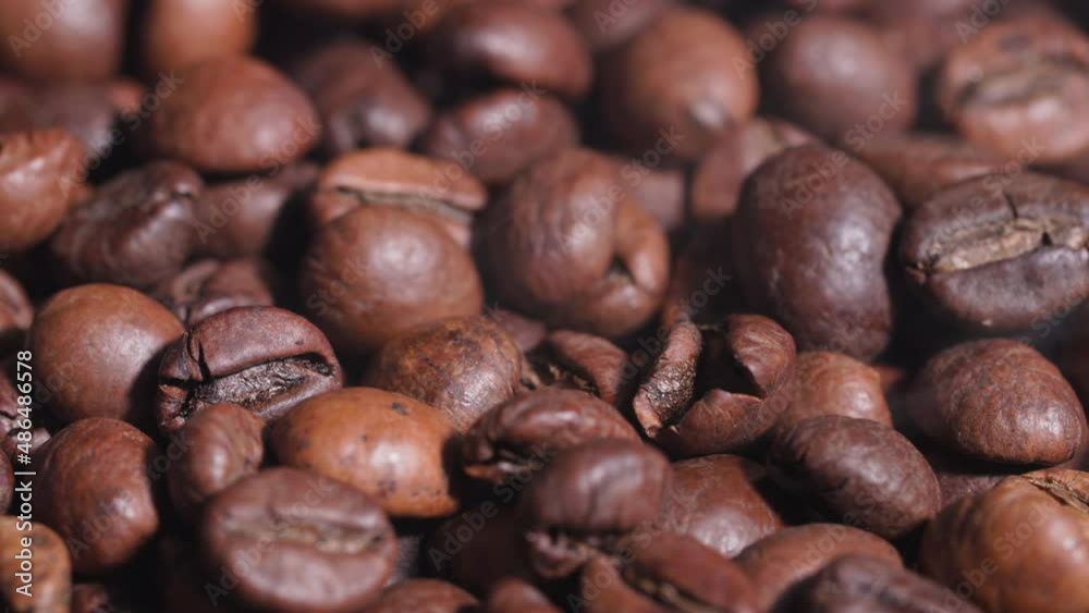 hot fragrant coffee beans in a frying pan in smoke during roasting hot fragrant coffee beans in a frying pan in smoke during roasting
