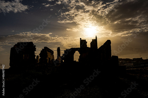 ruined castle in the canary islands in ruins with beautiful colors ruins of a bygone era of the canary islands with red colors known as the tojo de jinamar castle with ancient architecture