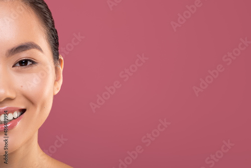 Half face of asian woman enjoying her beauty routine