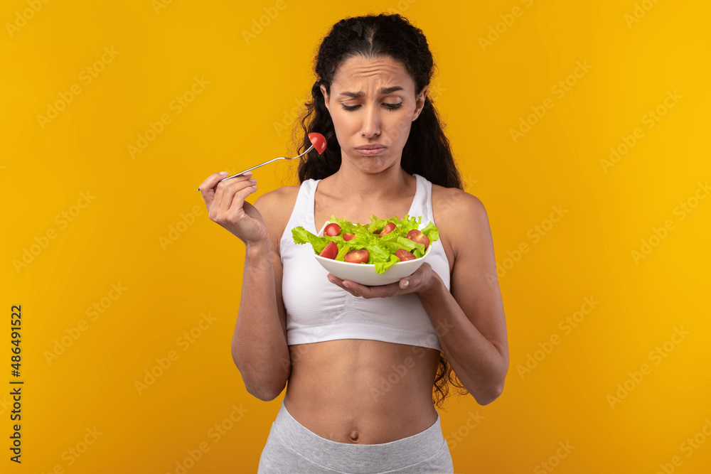 Portrait of Sad Lady Holding Plate With Vegetable Salad Portrait of Sad Lady Holding Plate With Vegetable Salad