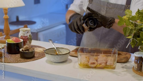 The chef salts Raw Chicken Meat Rolls