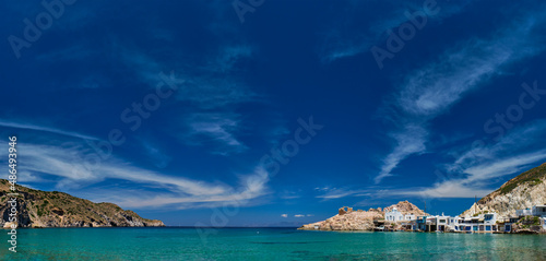 Panorama of the beach and fishing village of Firapotamos in Milos island, Greece photo