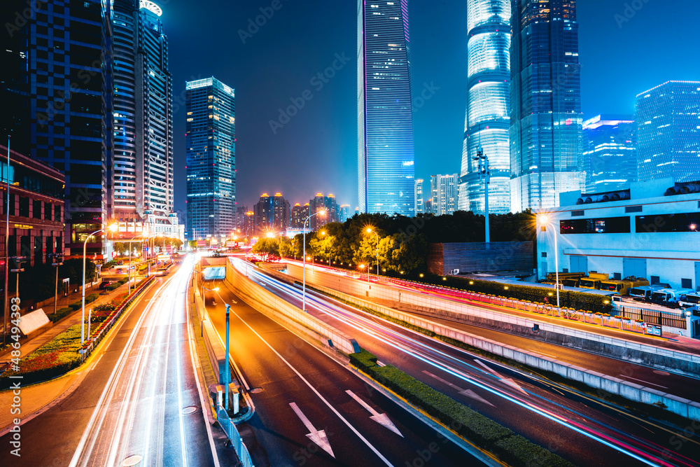 Fototapeta premium the light trails on the modern building background in shanghai china.