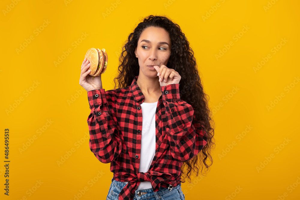 Happy Laughing Lady Eating Burger At Studio, Licking Finger Happy Laughing Lady Eating Burger At Studio, Licking Finger