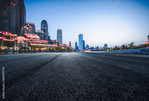 Asphalt road High way Empty curved road clouds and sky at sunset