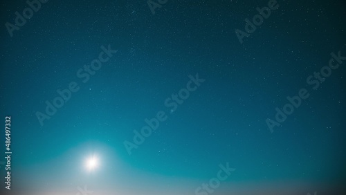 Blue Scenery Background Moonrise Night Starry Sky Glowing Stars. Scenic Bright Glow Of Sky Stars Galaxy 4K. Natural Background Backdrop.