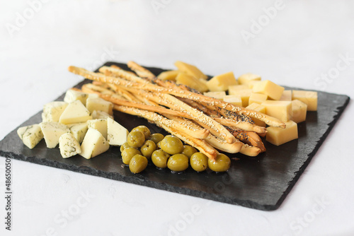 cheese plate bread sticks olives