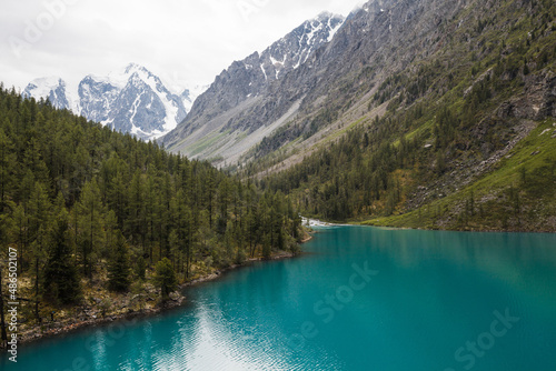 Clear lake and snow-capped peaks of the Altai mountains