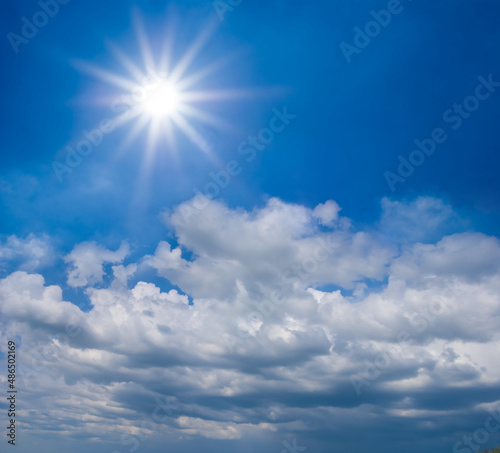 sparkle sun on dense cloudy sky background