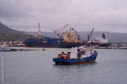 Принти на полотні Photo shows seaport with little ship in Atlantic ocean