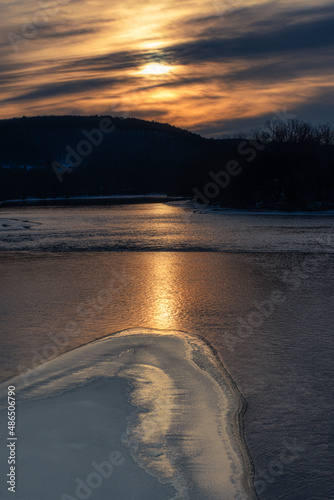 Taken from the South Washington Street Bridge in Binghamton in Upstate NY.  Ice on the river at Sunset.  This is the point where the Chenango and the Susquehanna River Converge into one.    photo