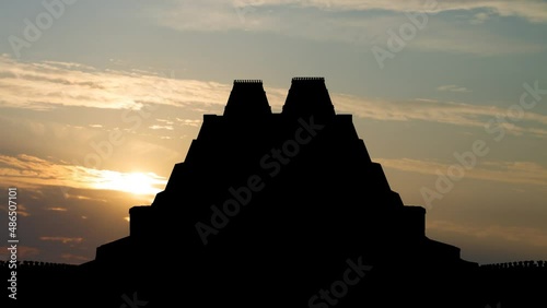 Aztec Templo Mayor: Time Lapse at Sunrise with Colorful Sky and dark Silhouette of aztec pyramid, Mexico photo