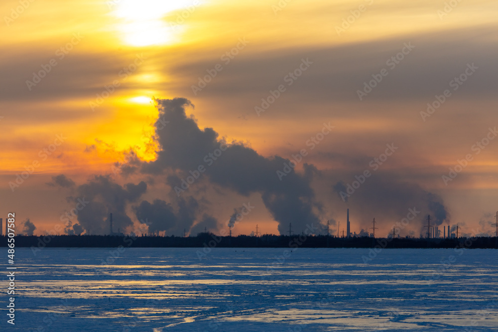 Smoke from the chimneys of a steel plant in winter