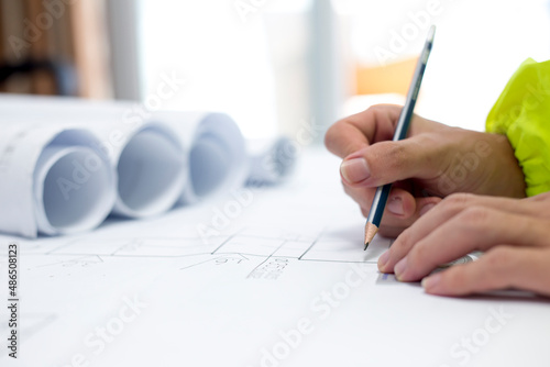 A male engineer is making engineering drawings.