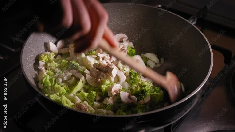 Hand Stirring with Wooden Spoon in Pan with Vegetables - Steady Shot Hand Stirring with Wooden Spoon in Pan with Vegetables - Steady Shot