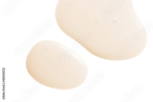 Creamy serum texture. Soft yellow skincare liquid drops. Cosmetic emulsion swatch isolated on white background