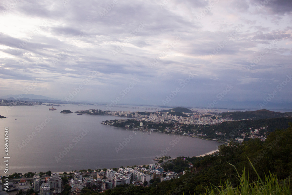 Rio de Janeiro viewed on the other side of Guanabara bay. Sunset view City Park Niterói.