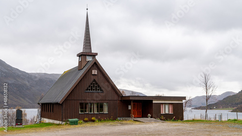 A Swedish churg near a lake, with an expressive sky photo