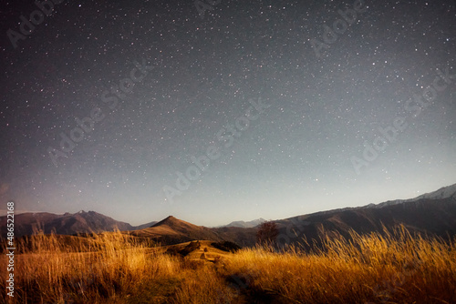 night landscape mountain and starry sky background, long exposure ,low light © ASHarchenko