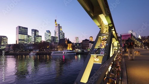 View from Eiserner Steg / The Iron Bridge on Main River to the business centre of the city Frankfurt, July 2019 photo