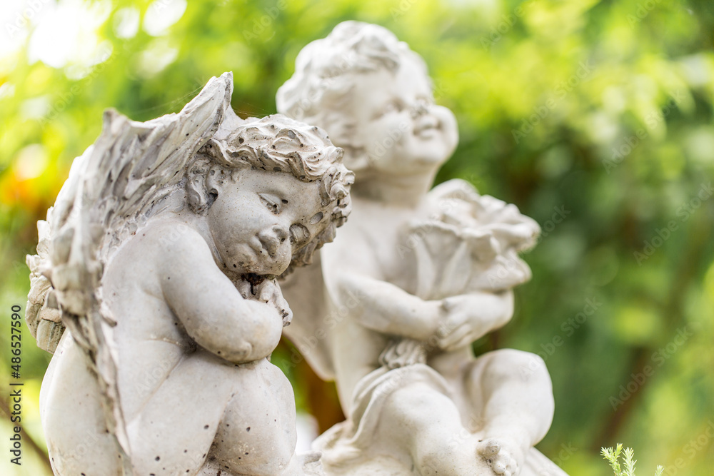 Sculpture of  angel in the park. Image made vintage tone.