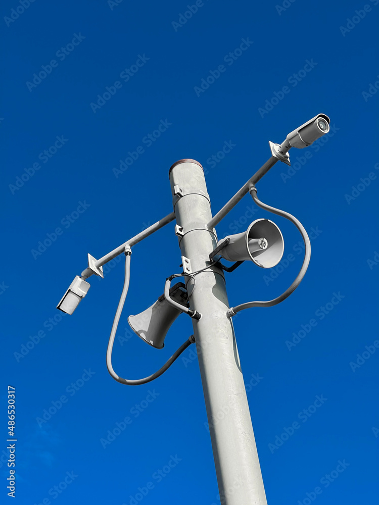 Surveillance camera on street lamp background bluesky Surveillance camera on street lamp background bluesky