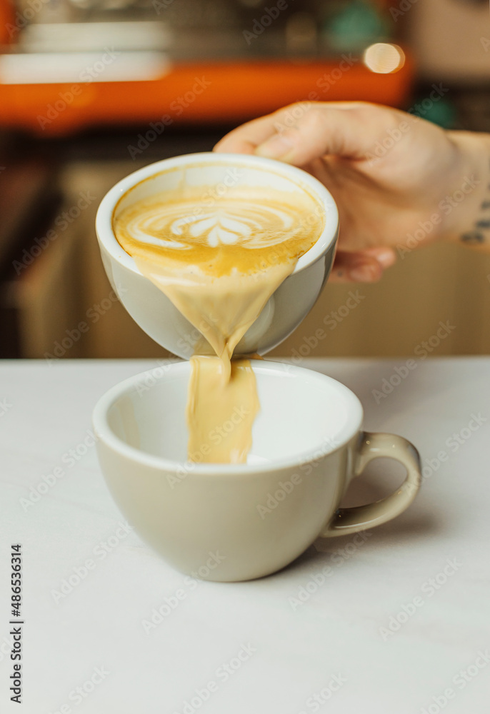 Hot beverage in the cafeteria. Tasty cappuccino in the cafe Hot beverage in the cafeteria. Tasty cappuccino in the cafe