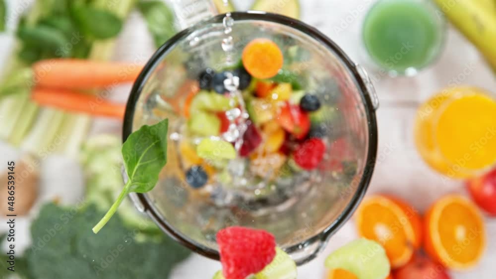 Super slow motion of falling pieces of vegetables and fruit into blender. Preparation of healthy fresh drink. Filmed on high speed cinema camera, 1000 fps. Speed ramp effect. Super slow motion of falling pieces of vegetables and fruit into blender. Preparation of healthy fresh drink. Filmed on high speed cinema camera, 1000 fps. Speed ramp effect.