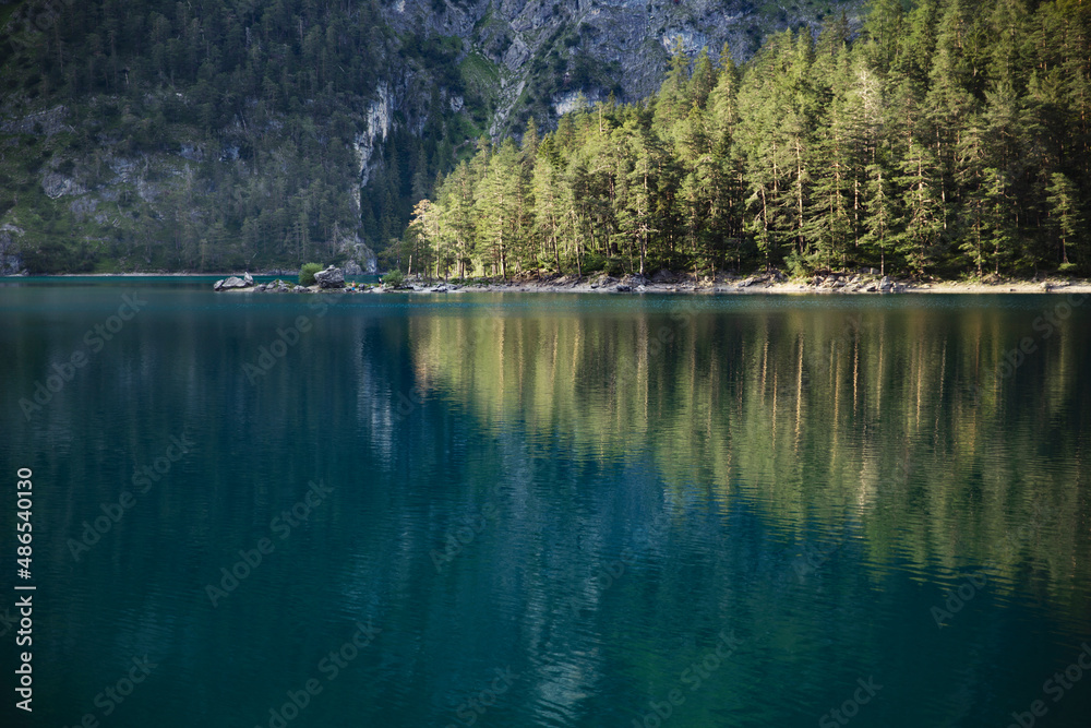 Fototapeta the concept of healthy lifestyle is to breathe fresh clean mountain air and enjoy the purity and azure color of the water on the magical lakes of the Alpine Mountains of Austria